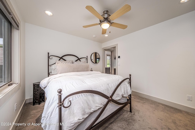 carpeted bedroom featuring recessed lighting, ceiling fan, and baseboards