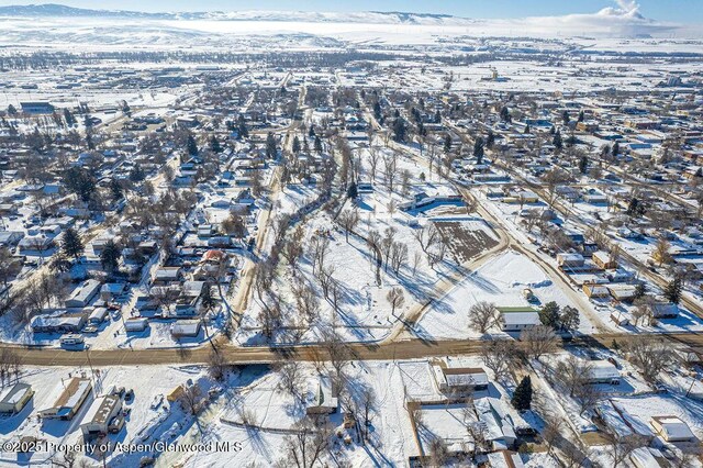 455 E 7th St, Craig, CO 81625 - snowy aerial view with a mountain view