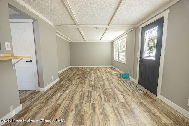 455 E 7th St, Craig, CO 81625 - entryway with wood finished floors, baseboards, and a textured ceiling