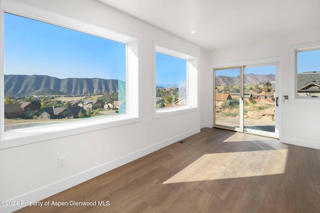 sunroom featuring a mountain view