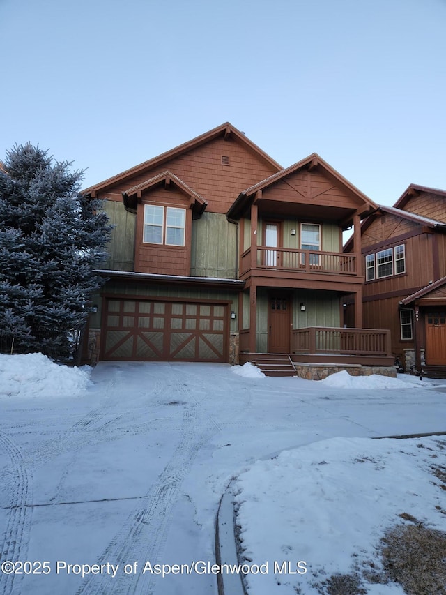 view of front facade featuring a balcony and a garage