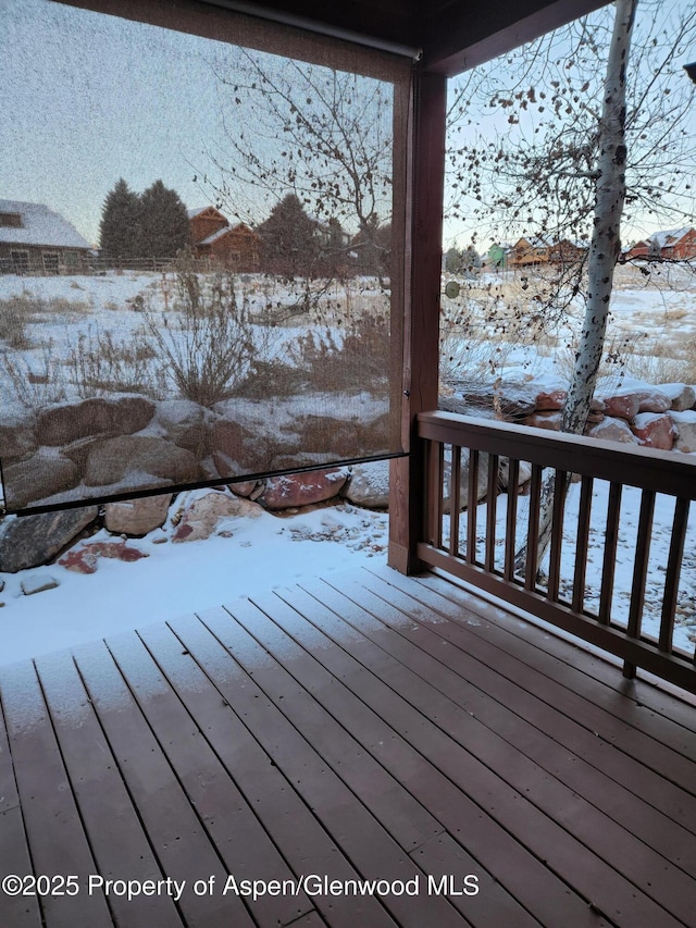 view of snow covered deck