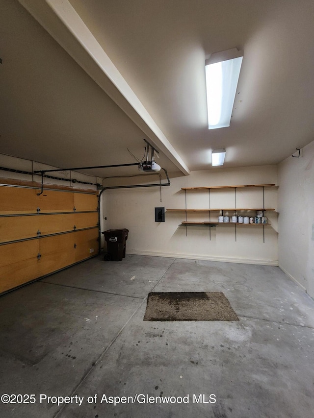 garage featuring a garage door opener and electric panel