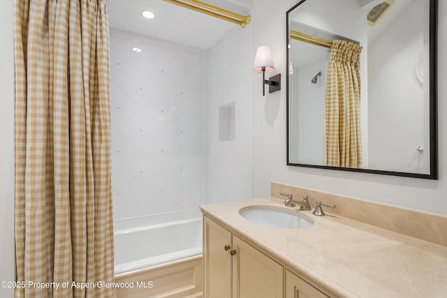 bathroom featuring vanity and shower / tub combo with curtain