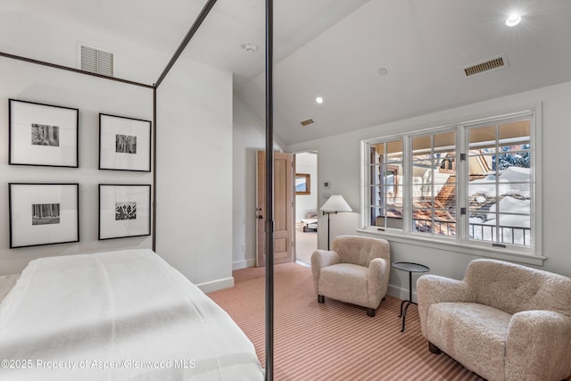 bedroom featuring light carpet and lofted ceiling