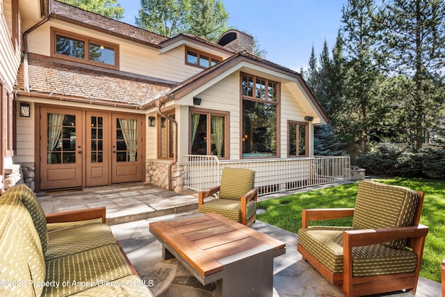 back of house featuring central AC and a patio area