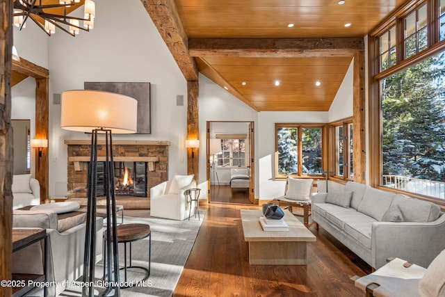 living room with dark hardwood / wood-style floors, a healthy amount of sunlight, and wooden ceiling