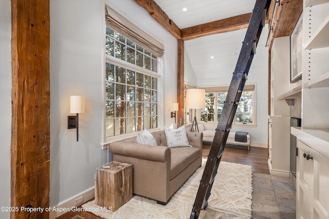 sitting room featuring vaulted ceiling with beams and light wood-type flooring