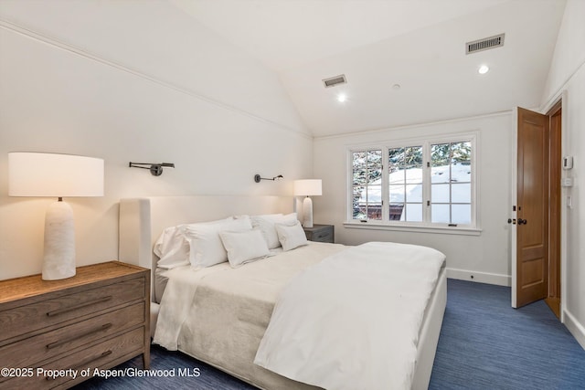 bedroom featuring dark carpet and lofted ceiling