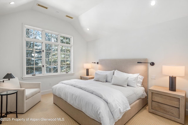 bedroom with light carpet and vaulted ceiling