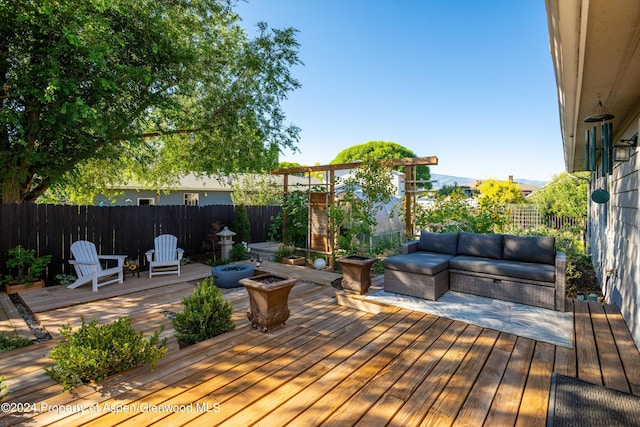 wooden terrace featuring an outdoor hangout area