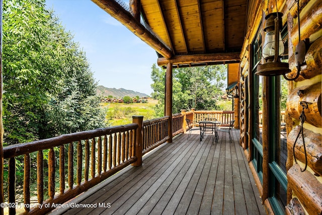 wooden terrace with a mountain view