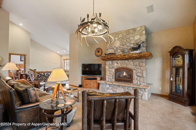 living room with a stone fireplace, carpet, a notable chandelier, and high vaulted ceiling