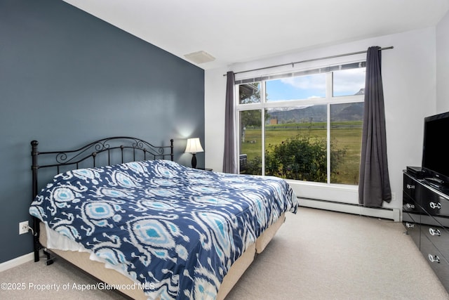 156 Limberpine Cir, Parachute, CO 81635 - bedroom featuring baseboard heating and carpet floors