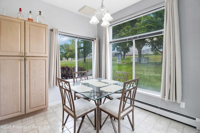 156 Limberpine Cir, Parachute, CO 81635 - dining area featuring baseboard heating and a chandelier