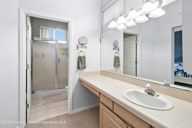 156 Limberpine Cir, Parachute, CO 81635 - bathroom with a shower stall, vanity, toilet, baseboards, and a chandelier