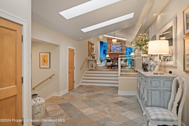 interior space with lofted ceiling with skylight