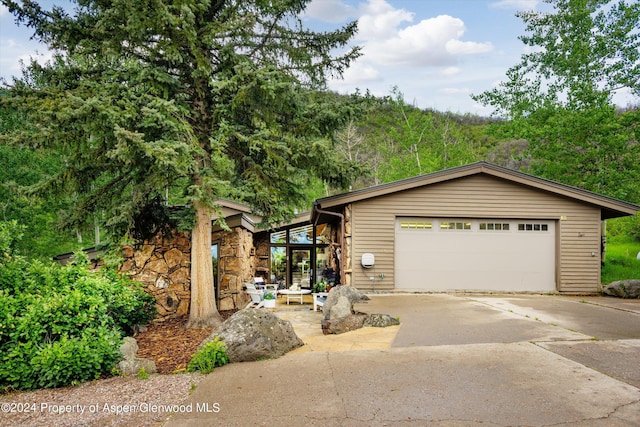 view of front of property with a garage