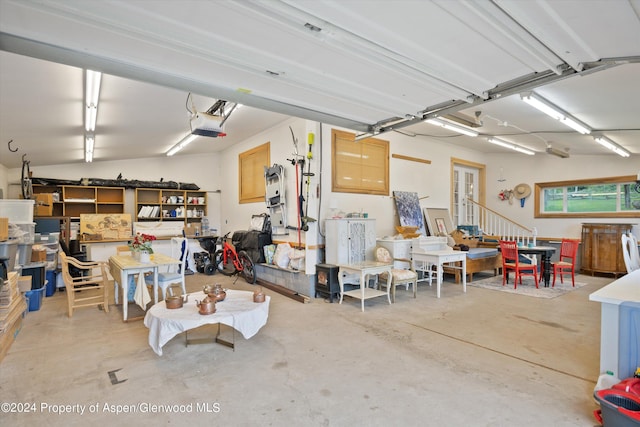 garage featuring french doors and a garage door opener