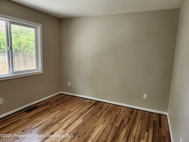 737 Rose St, Craig, CO 81625 - unfurnished room featuring wood finished floors and baseboards