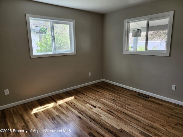 737 Rose St, Craig, CO 81625 - unfurnished room with plenty of natural light, baseboards, and wood finished floors