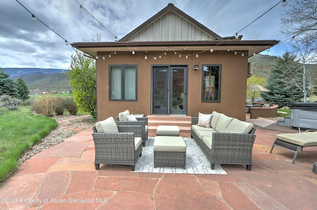 86 Sunrise Ct, Glenwood Springs, CO 81601 - back of property featuring board and batten siding, stucco siding, and a patio area