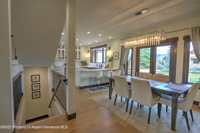 86 Sunrise Ct, Glenwood Springs, CO 81601 - dining space featuring a chandelier, healthy amount of natural light, light wood-style flooring, and recessed lighting