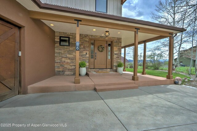 86 Sunrise Ct, Glenwood Springs, CO 81601 - entrance to property featuring stone siding, board and batten siding, and a porch