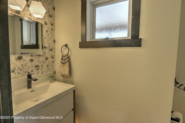 86 Sunrise Ct, Glenwood Springs, CO 81601 - bathroom featuring vanity and tasteful backsplash