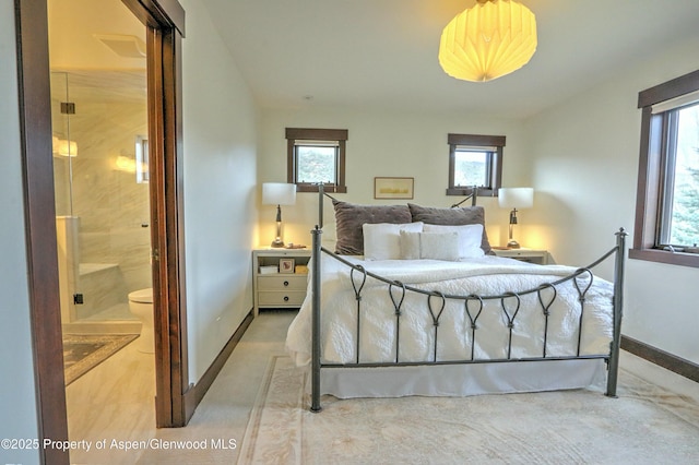 86 Sunrise Ct, Glenwood Springs, CO 81601 - bedroom with multiple windows and ensuite bath