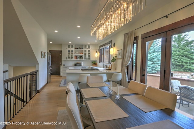 86 Sunrise Ct, Glenwood Springs, CO 81601 - dining room with light wood-style flooring and recessed lighting