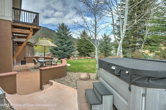 86 Sunrise Ct, Glenwood Springs, CO 81601 - patio / terrace featuring a hot tub, a patio, and outdoor dining space