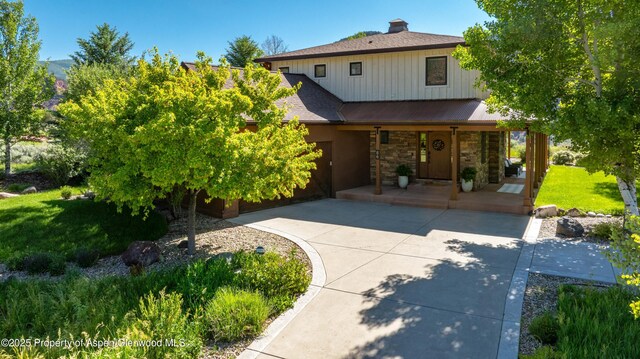 86 Sunrise Ct, Glenwood Springs, CO 81601 - view of front of home featuring a porch, stone siding, a front lawn, and a shingled roof