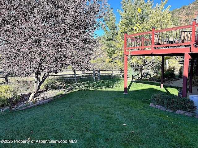 view of yard featuring a wooden deck