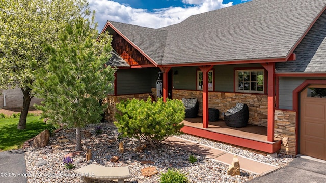 10 Laird Ln, Glenwood Springs, CO 81601 - view of exterior entry with roof with shingles, stone siding, and a porch