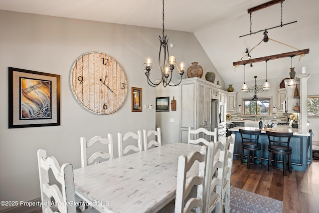 10 Laird Ln, Glenwood Springs, CO 81601 - dining space with dark wood-type flooring, high vaulted ceiling, and a chandelier