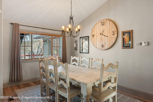 10 Laird Ln, Glenwood Springs, CO 81601 - dining space featuring vaulted ceiling, wood finished floors, baseboards, and a chandelier