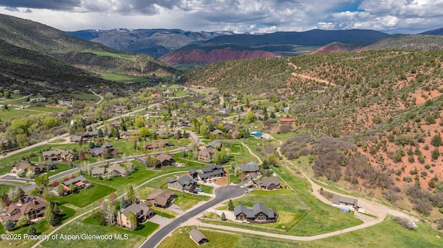 10 Laird Ln, Glenwood Springs, CO 81601 - aerial view of property and surrounding area featuring a mountainous background and nearby suburban area
