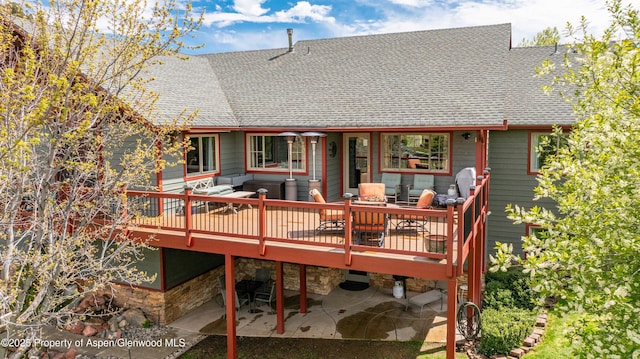 10 Laird Ln, Glenwood Springs, CO 81601 - rear view of property featuring a shingled roof, a deck, an outdoor hangout area, and a patio