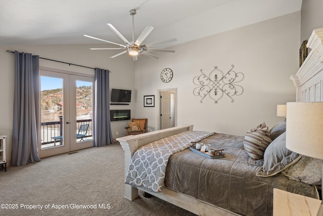 carpeted bedroom featuring vaulted ceiling, ceiling fan, french doors, and access to outside