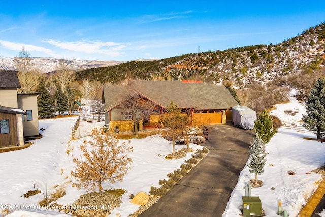 view of front of house featuring a mountain view and a garage