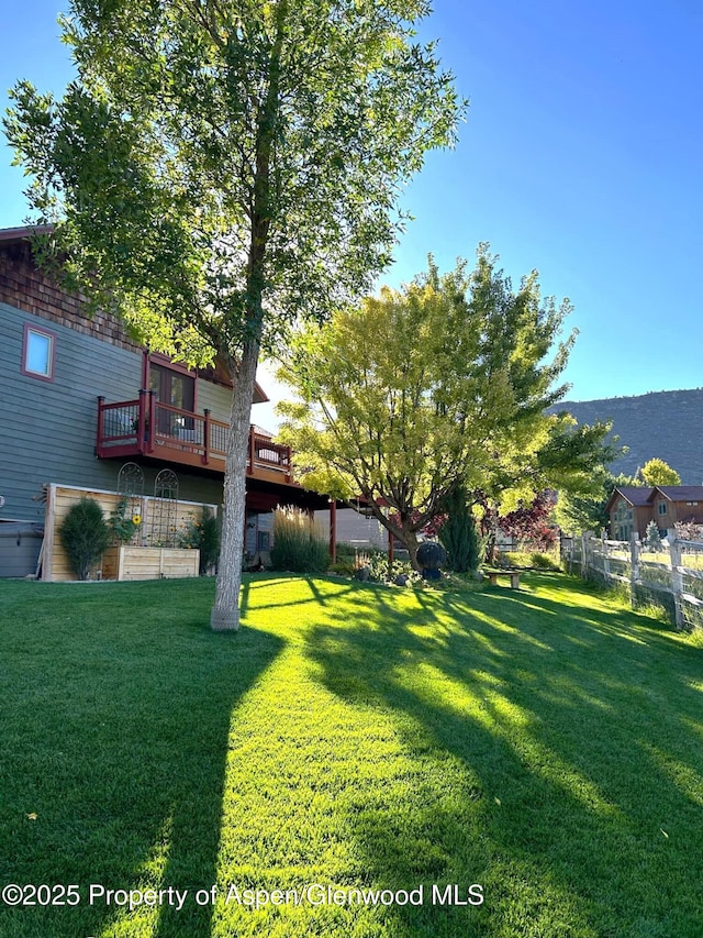 view of yard with a deck