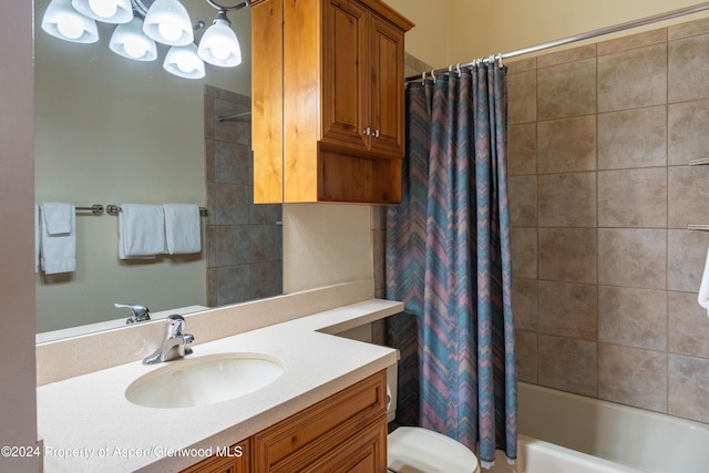 full bathroom featuring shower / bath combination with curtain, vanity, and toilet