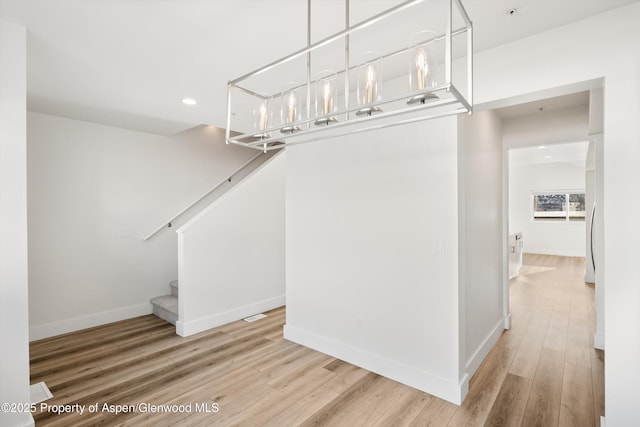 corridor featuring hardwood / wood-style floors