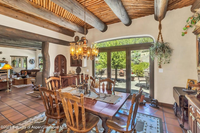 tiled dining area with beam ceiling, a chandelier, french doors, and wooden ceiling