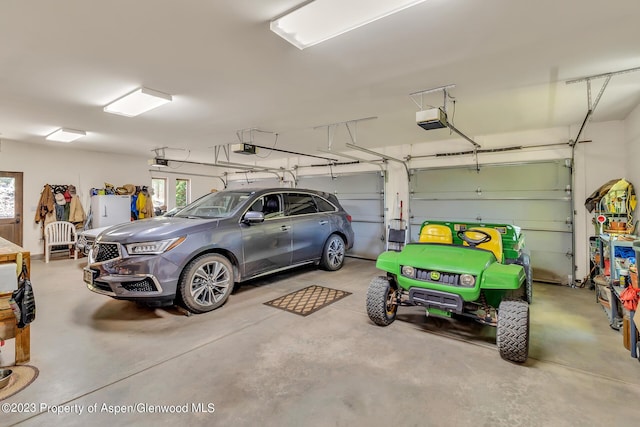 garage featuring a garage door opener