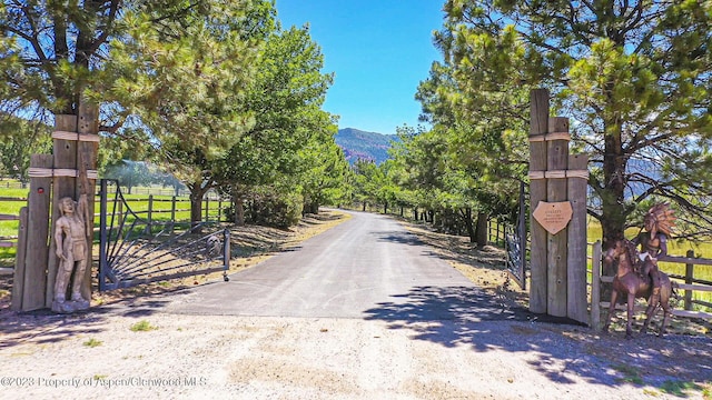 view of street featuring a mountain view and a rural view