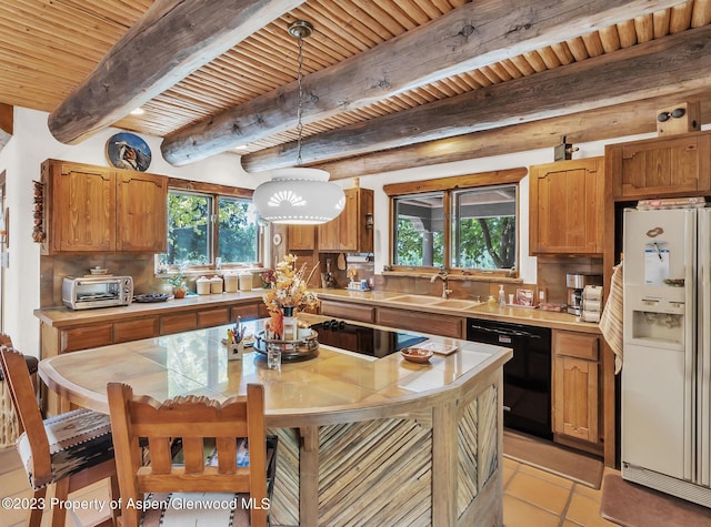 kitchen with dishwasher, decorative light fixtures, white refrigerator with ice dispenser, and beam ceiling