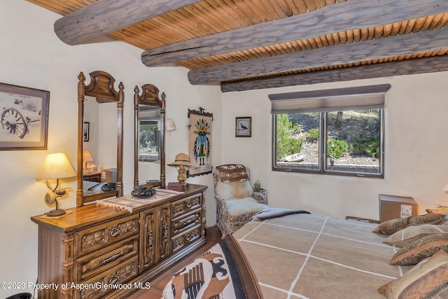 bedroom with beam ceiling and wood ceiling