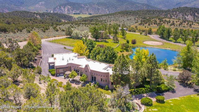 aerial view featuring a water and mountain view